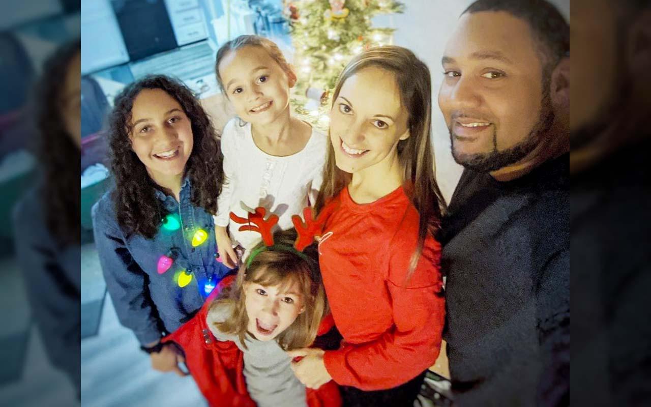 Amy M. and family around Christmas time.