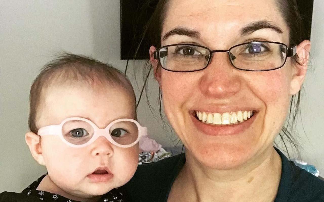 Mom Dana with baby Livia showing off their new glasses