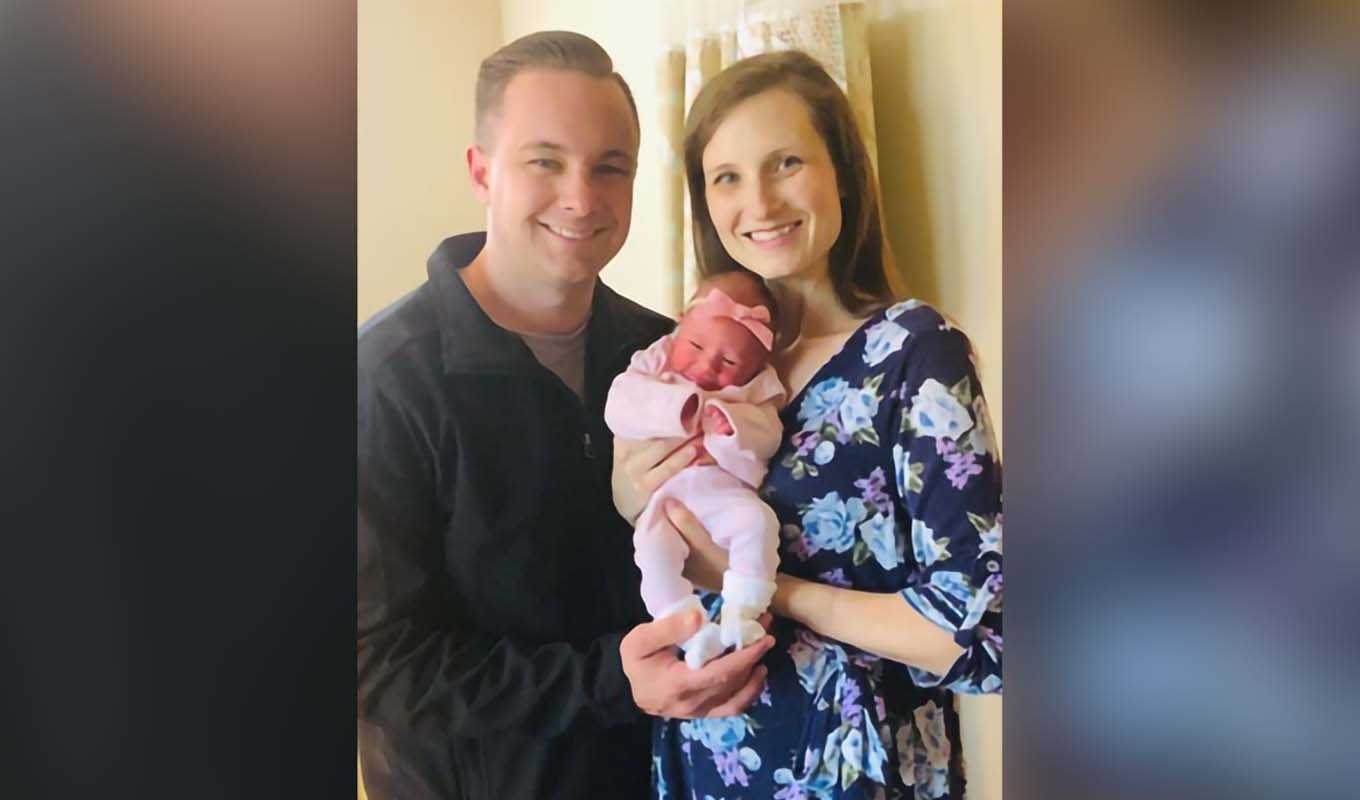 McKenna Cassia is held by her parents, Brady and Malynda.