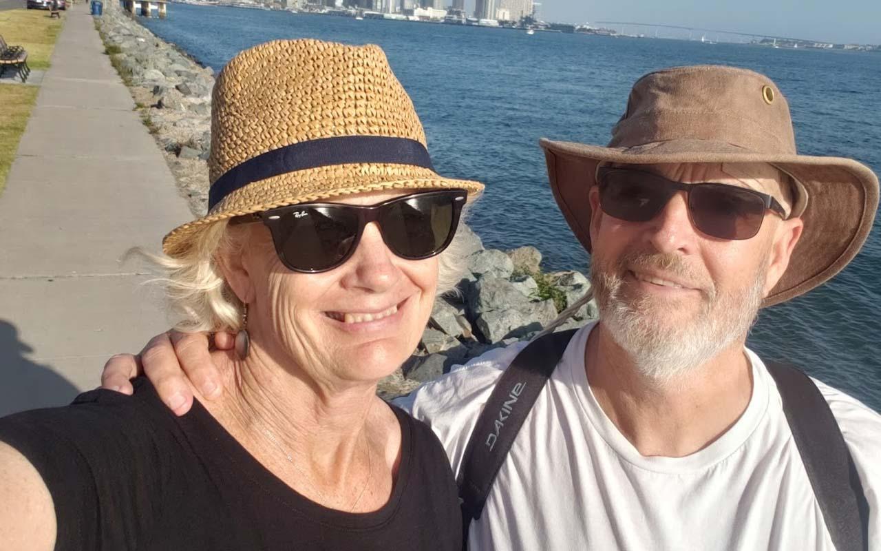 Jeff and Jane Richards on a walkway by water