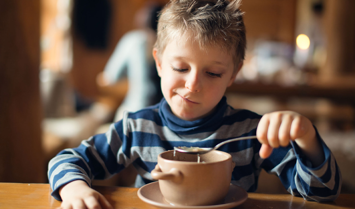 Collage of kid‑friendly foods for picky eaters, including yogurt, dry pasta noodles, ground beef tacos, blueberry muffins, and fruit‑flavored snack cubes.