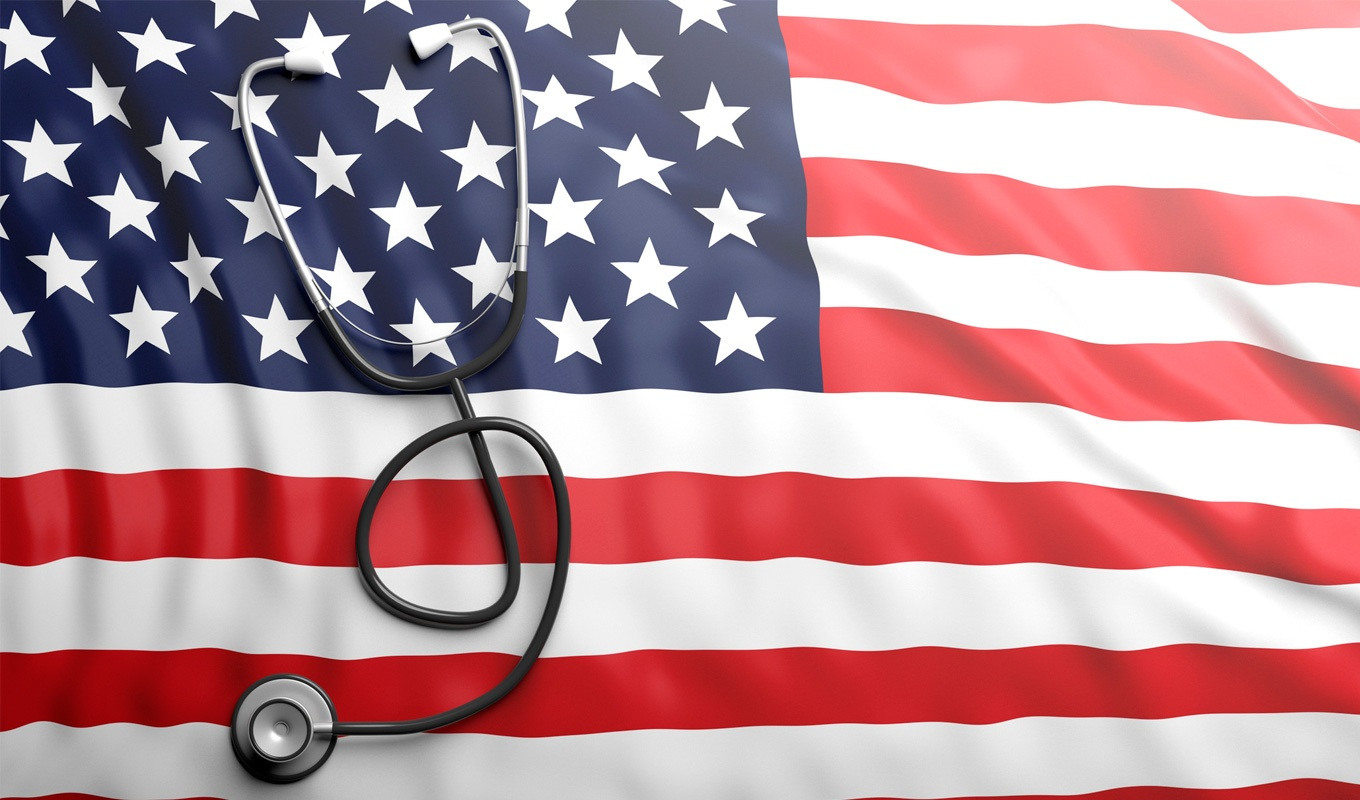 Stethoscope laying across an American flag