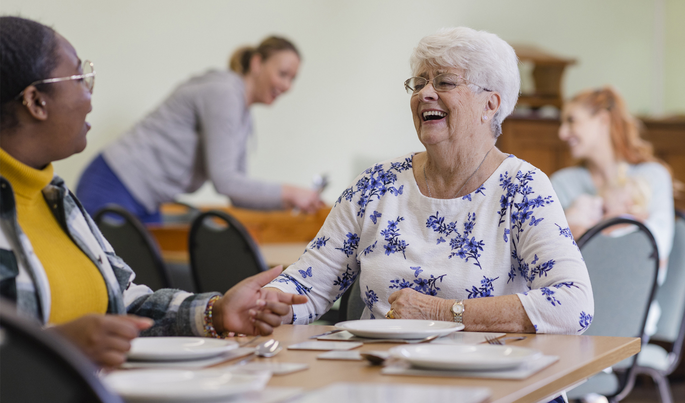 Elderly woman dining.