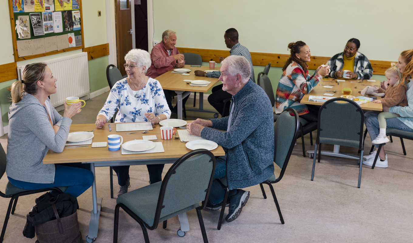 Elderly people sitting at table