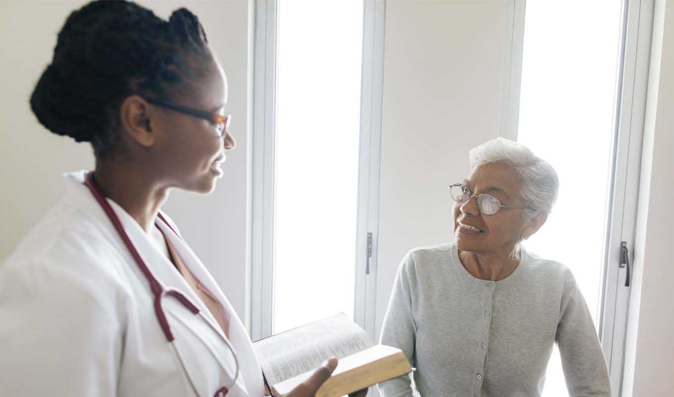 Doctor speaking with an elderly patient