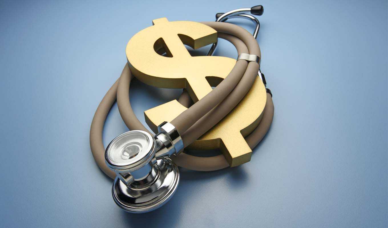 Stethoscope wrapped around a dollar sign