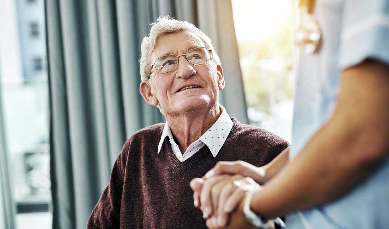 Elderly man with a nurse