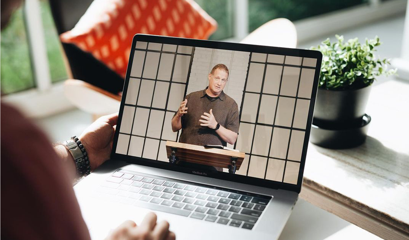 Watching a sermon on a laptop