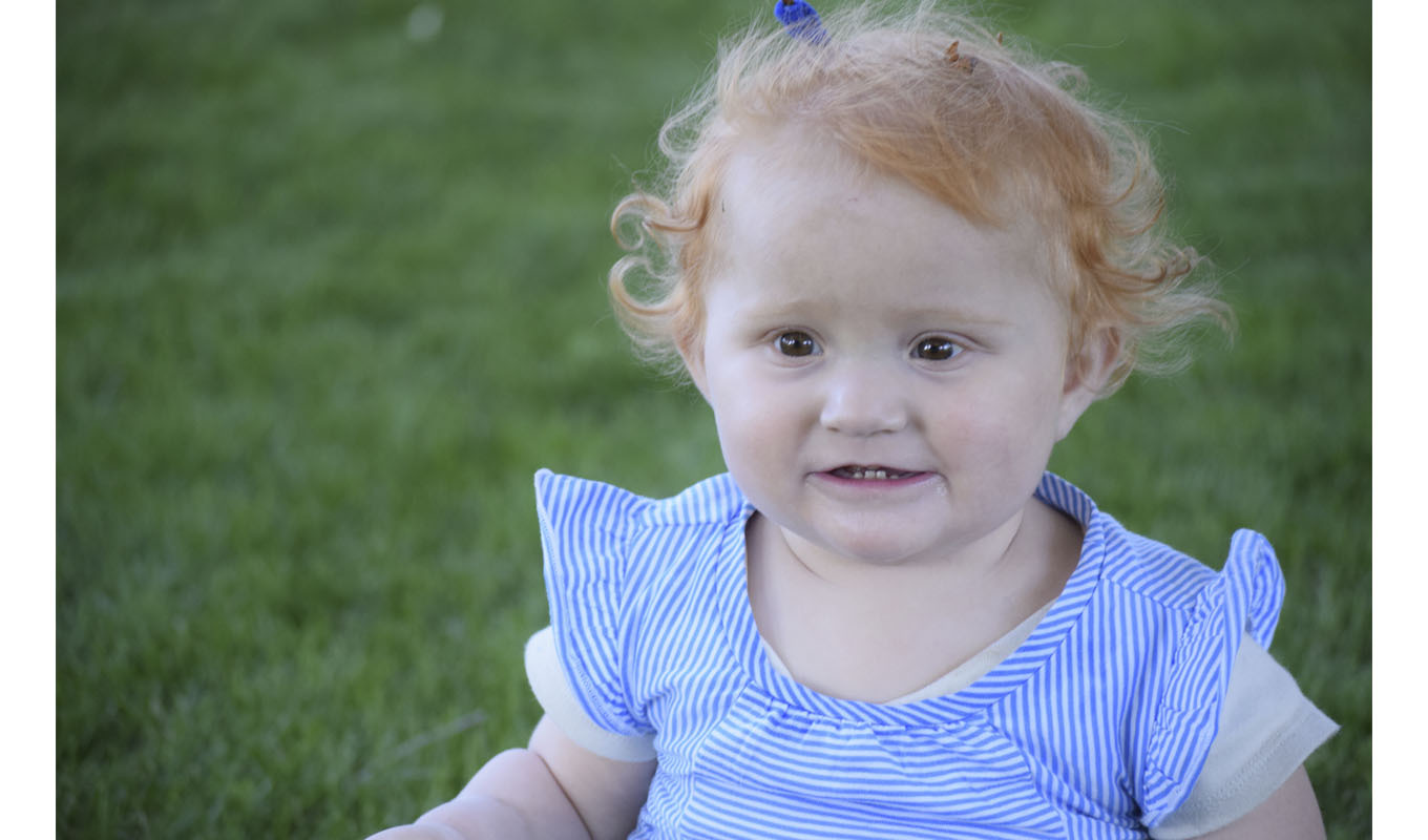 Closeup of toddler playing outside