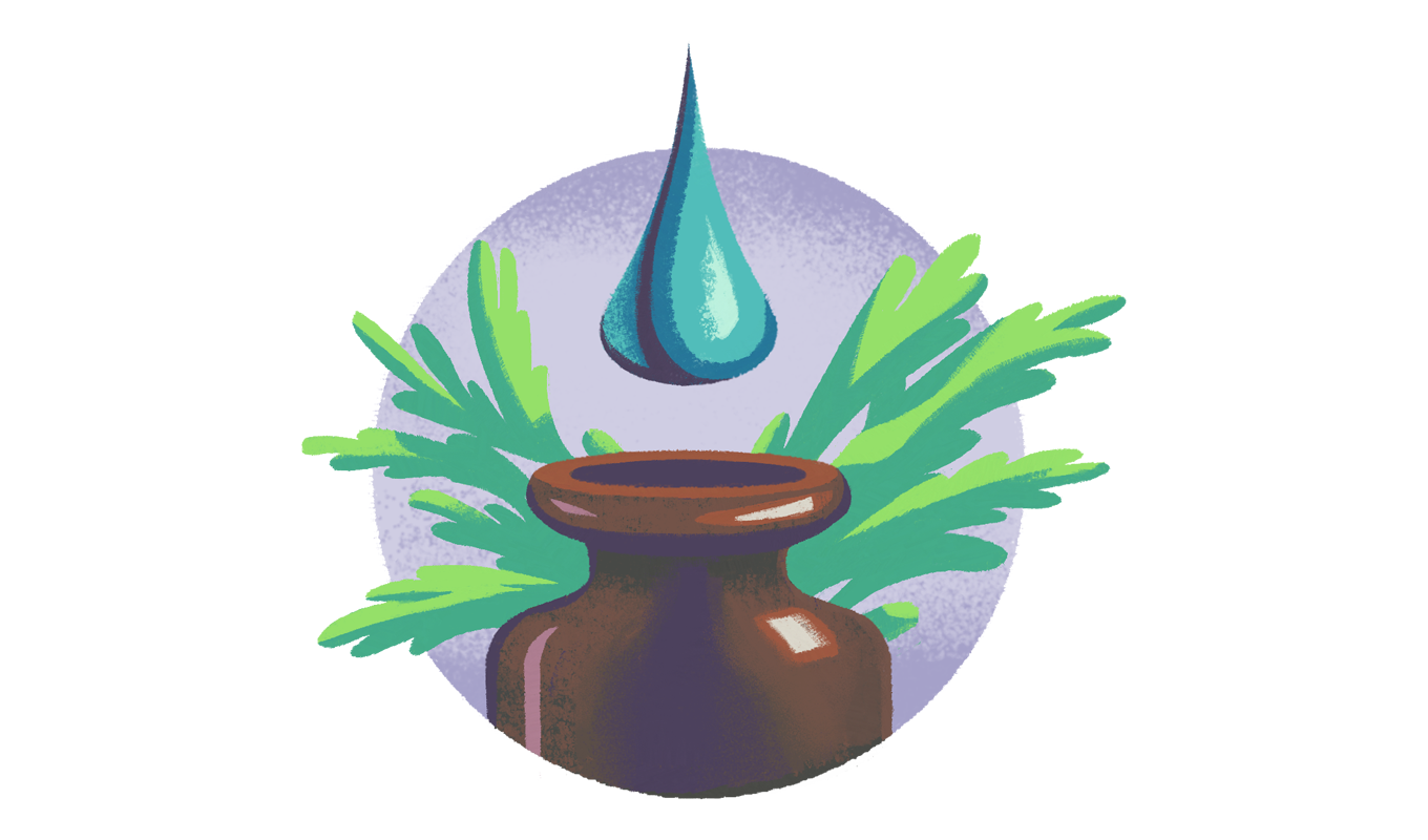 A drop of oil falls toward an open bottle nestled in leaves.