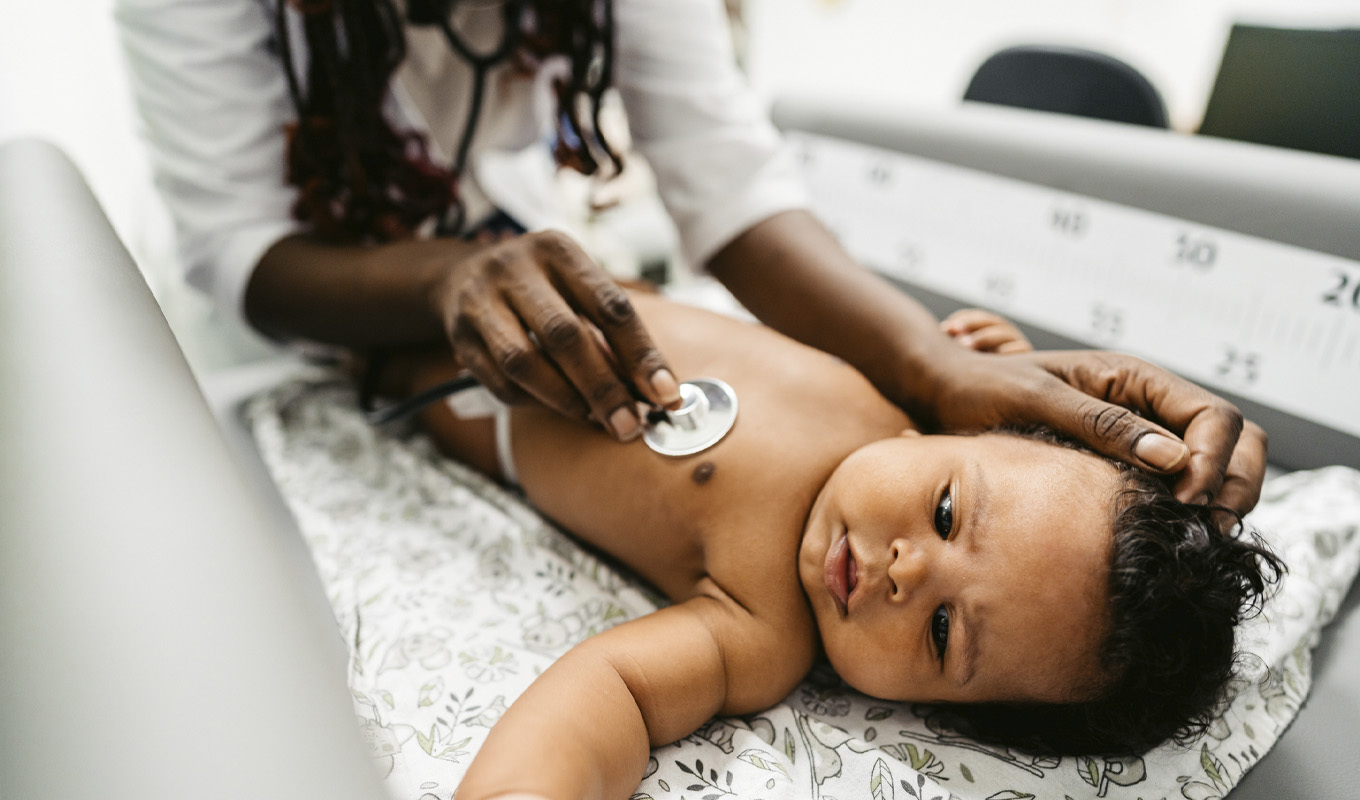 Nurse tends to baby.