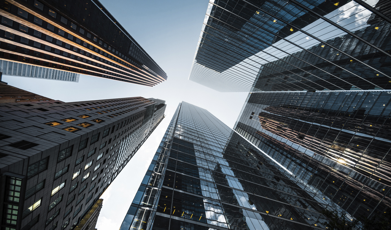 Upward photo of several large skyscrapers