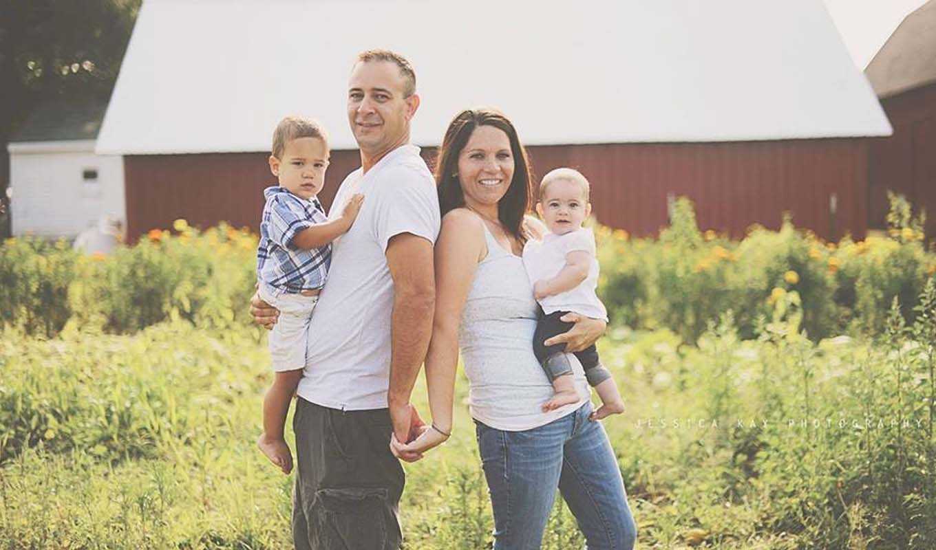 Joel and Anna Troyer, with their two young toddlers