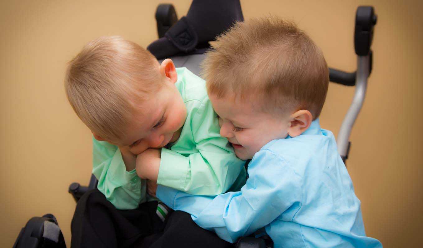Two toddlers hugging