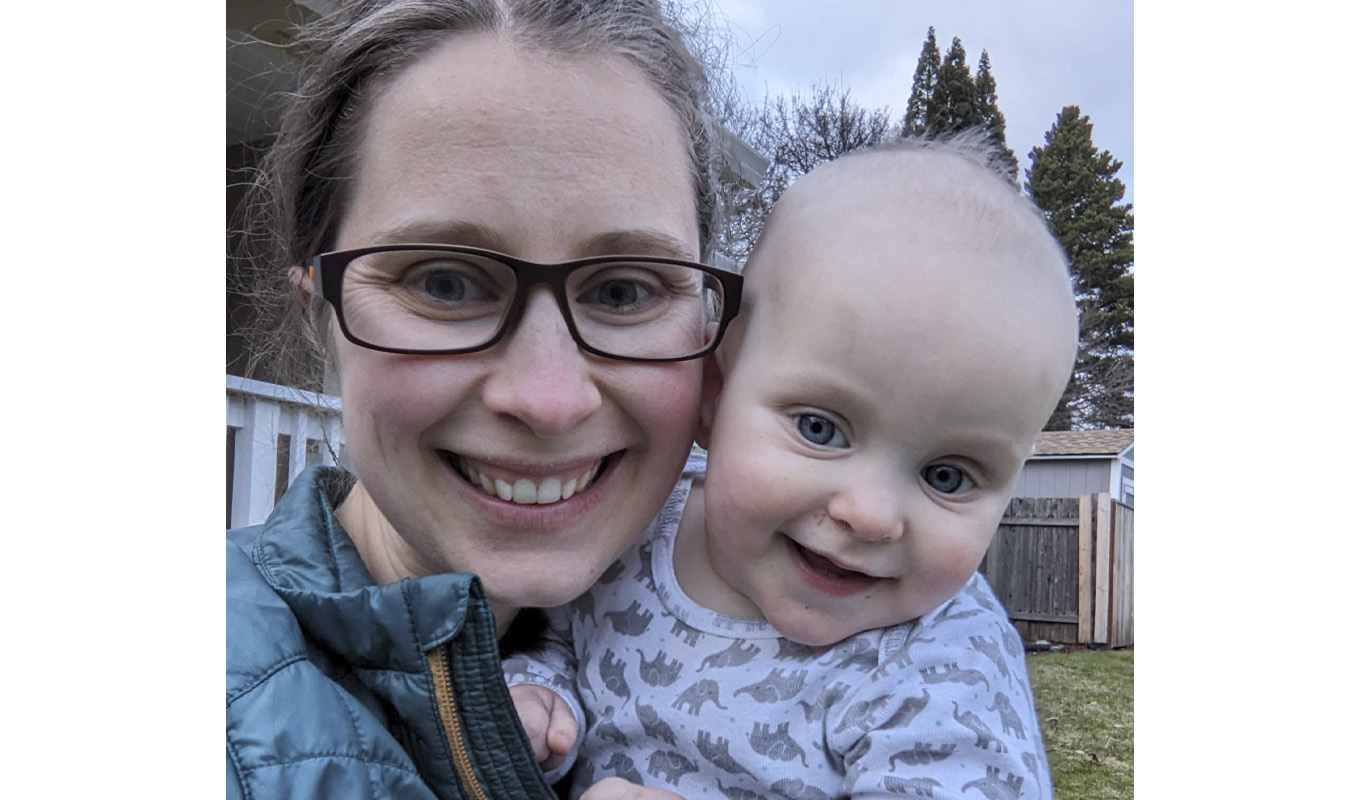 Mom holds baby.