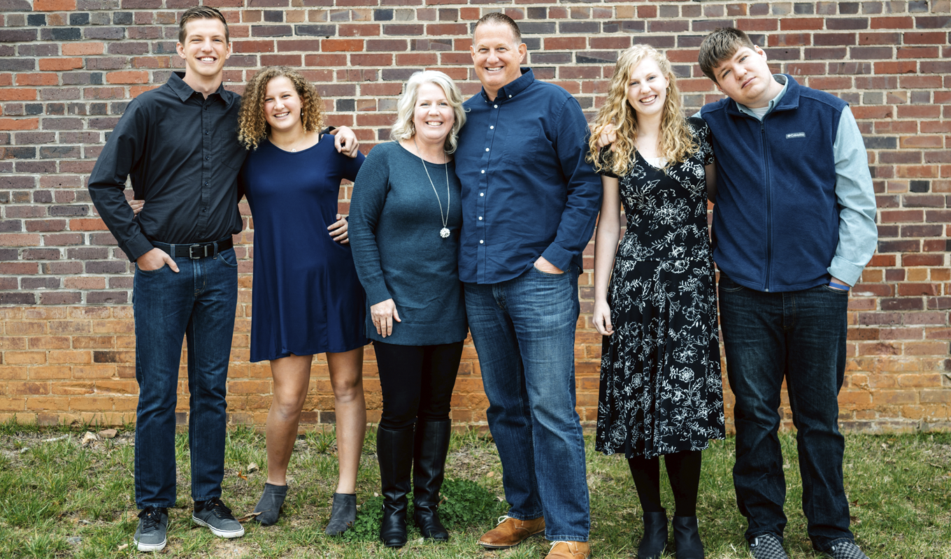 Brian and Cheryl Lowe with their 2 adult children and their spouses