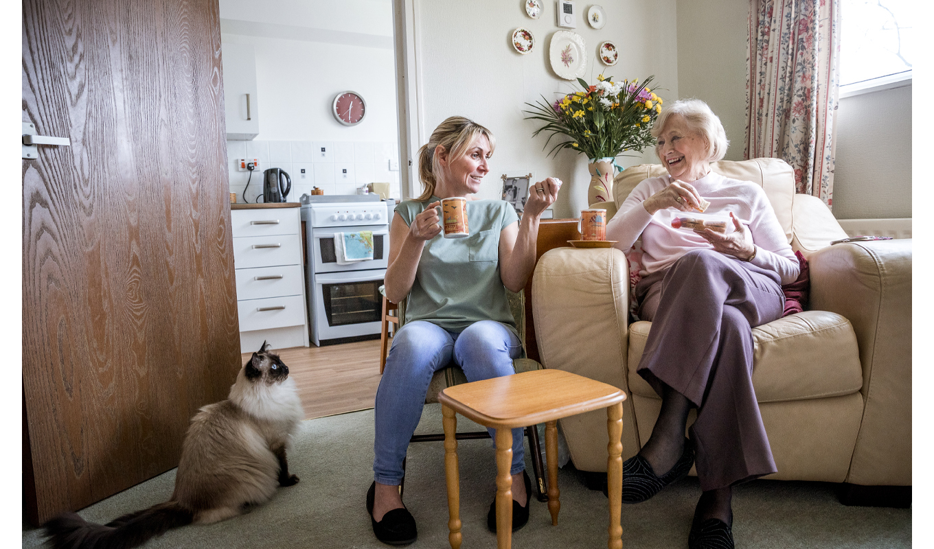 Elderly woman visiting with her adult daughter