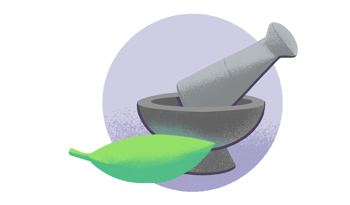 Pestle resting in a bowl next to a leaf.
