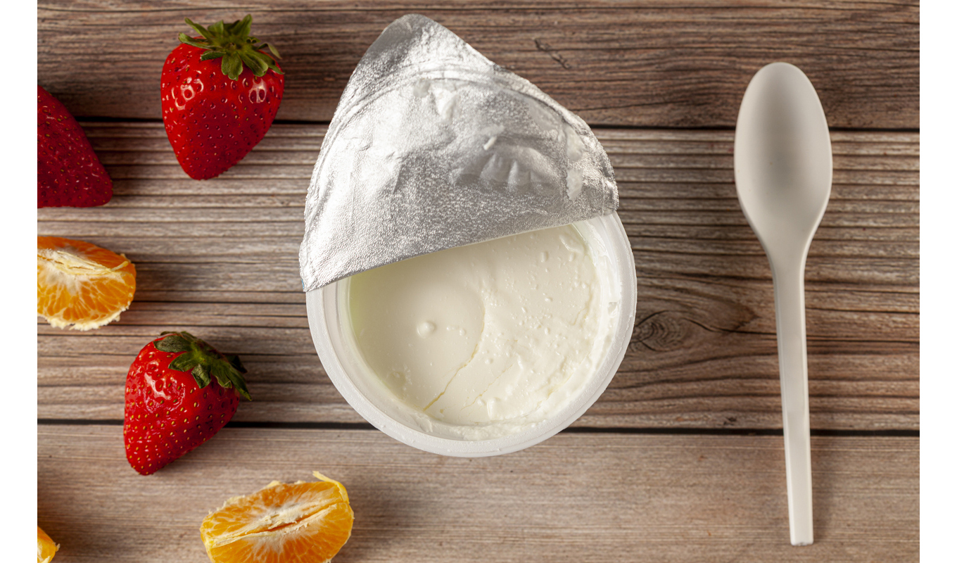 Yogurt cup on a dining room table.