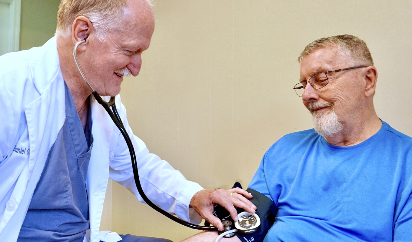 Dr. Daniel O'Roark tends to a patient at Trinity Heart and Vascular Group in Tennessee.