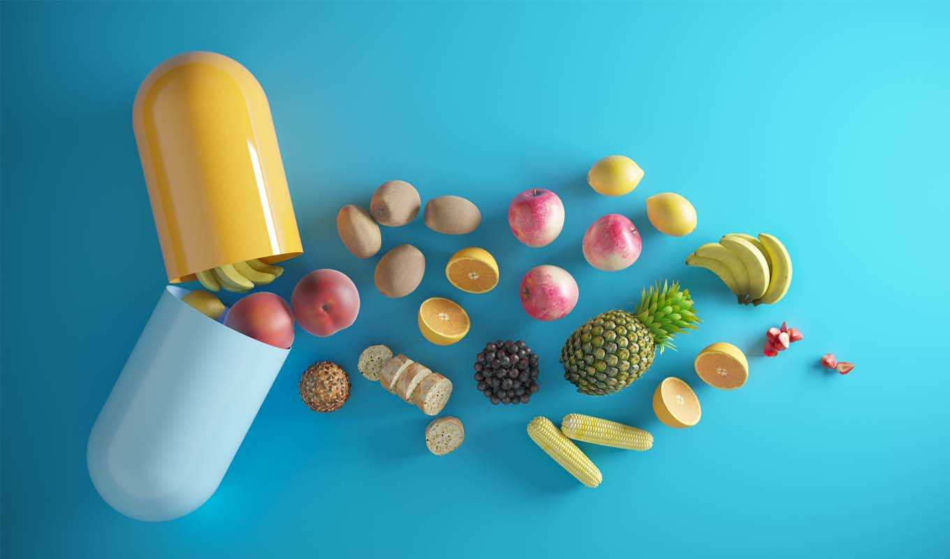 Giant vitamin being opening to spill out fruit