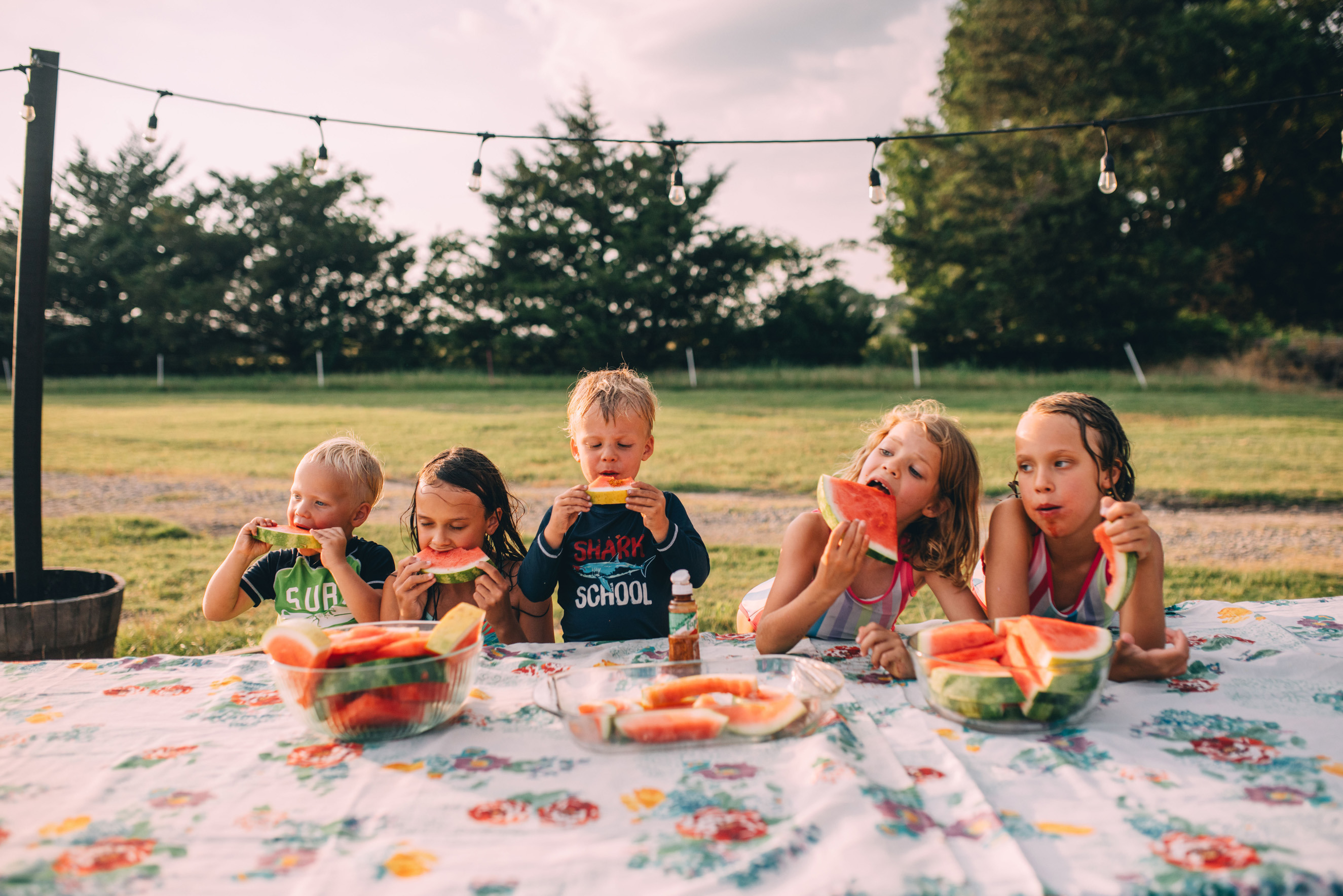 Kelly and Kendall's five children enjoying a snack outside